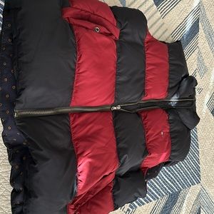 Used Tommy Hilfiger puffer vest in medium size.